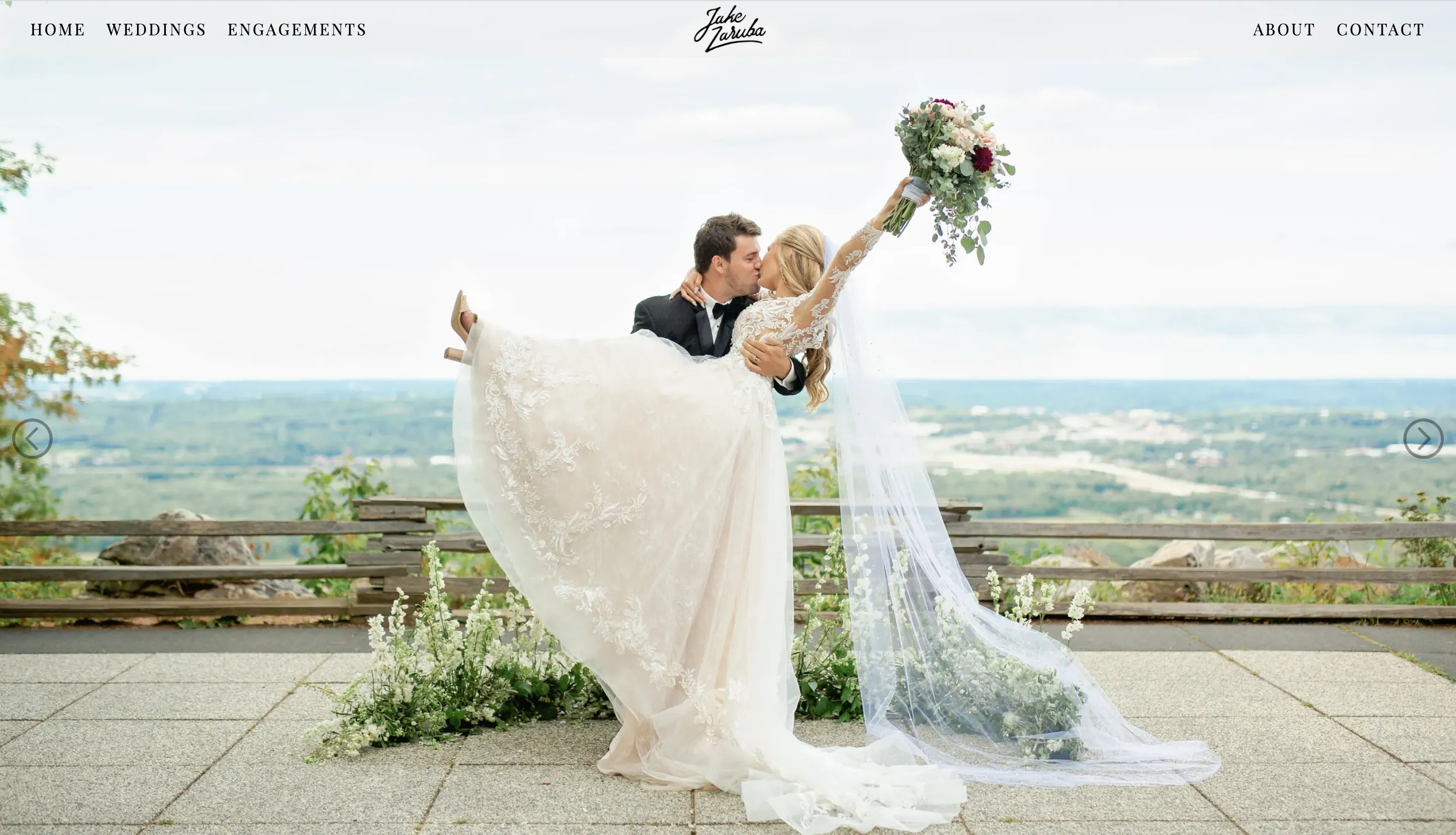 Screenshot of the fullscreen slider on my wedding website's home page. On the slider is a groom holding and kissing his bride on a hilltop.